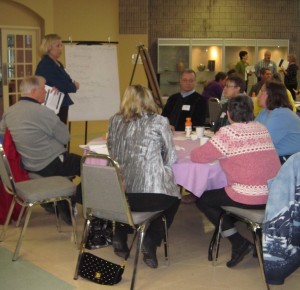 Tracy Burrows, by Law enforcement officer, taking citizens through a budget input session held at the Burlington Arts Centre