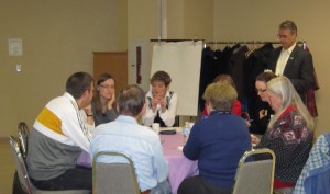 Mayor Rick Goldring listens from the side lines as citizens discuss the budget he has to get through his council.