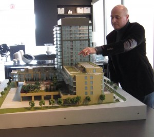 Partner Graham Chalmers points out detail on an architect’s model of the project due to begin construction at Appleby Line and Upper Middle Road in the Spring.
