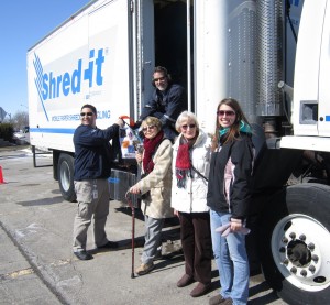 Kelly Gorven, on the right side of this picture, is a Crime Stoppers Board member who has served on the organization since her days as a Sheridan College student.  The Shred it trucks chewed up documents in a matter of seconds. Shown with Kelly are two citizens who took advantage of the shredding opportunity.