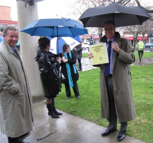 Mayor Goldring, out on the street in the rain with his staff while the fire alarm is checked.  The Mayor brought his emergency Measures Manual with him.