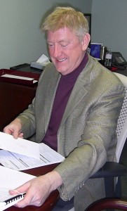 Sharman without glasses with paper Sharman says “Council has an information deficit”. Acting Executive Director of Finance is going to have to act quite a bit faster.