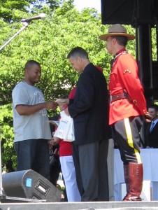 After being sworn in, the 31 New Canadians were given their Certificates of Citizenship and greeted warmly by Mike Wallace, MP, Joyce Savoline, MPP, Gary Carr, Chair of the Region of Halton and Rick Goldring, Mayor of Burlington – and then bid welcome to Canada by a member of the Royal Canadian Mounted Police.