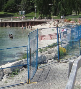 Perhaps we can call it:  Instant Beach, a short stretch of sand created as a result of the change in water flow when the shape of the embankment was changed as the pier was being built.  It is certainly being used.