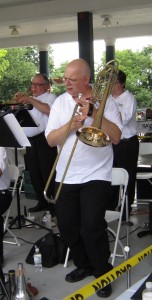 A member of the Sophisticated Sound Orchestra pauses to check his sheet music as the Orchestra played popular songs. 