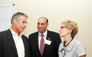 Mayor Rick Goldring in conservation with Minister of Transportation Kathleen Wynne with Liberal candidate Karmel Sakran looking on.  The Mayor isn’t all that sure the Minister’s promise not to run a highway through the Escarpment is something he can rely upon.  Sakran is hoping her promise will deliver some of those old Tory votes to him.