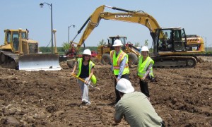 Mayor Rick Goldring along with a Parks department staff member and Ward 6 Council member Blair Lancaster turn sod at the Palladium Way soccer field that will serve the needs of the community in the north east part of the community.