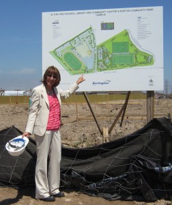 Mercanti in front of sign Cindy Mercanti stands before the bill board that shows what is about to be built on the site north of Dundas and West of Walkers Line. Major change for that part of Burlington.