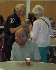 Constable Wendy Moraghan of the Halton Regional Police Service works with seniors in their communities within the Halton Region listening to concerns they have and explaining a problem they should be cautious about.