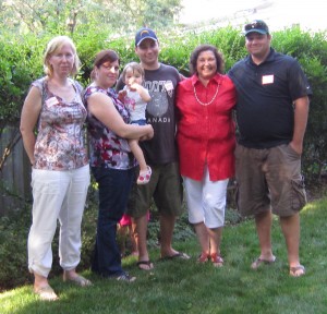 If you don’t have you family delivering flyers and knocking on doors then you really don’t have a campaign team.  NDP candidate Peggy Russell poses with part of team.