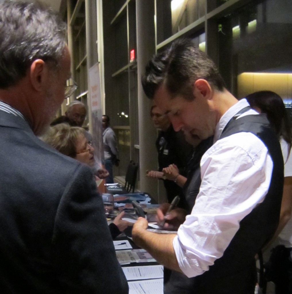 Royal Wood signing CD's after the first commercial event at the Burlington Performing Arts Centre. They loved him.