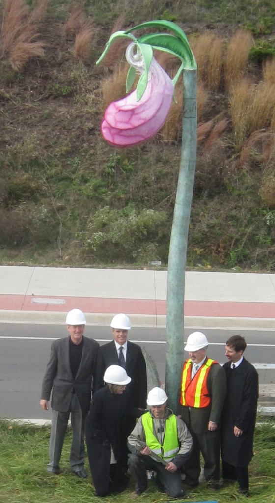 Civic officials and politicians gather around the $100,000 piece of public art. Can you name all of the ùsual suspects`É