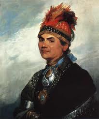 In this portrait Joseph Brant is seen wearing the gorget given to him by King George III. That gorget is the most important piece in the collection at the Joseph Brant Museum.