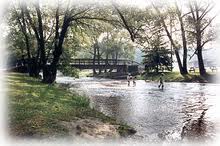 A river runs through the park where the salmon spawn and children get to play.