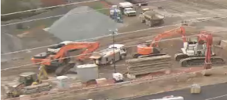 Excavating equipment gassing up 1230 pm