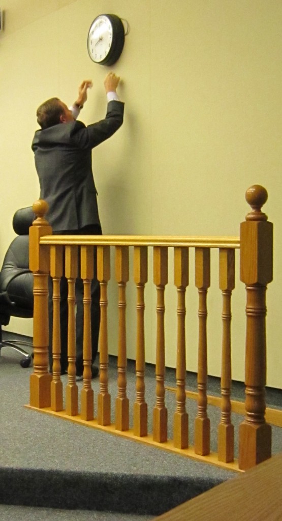 Frank McKeown, Mayor's Chief of Staff, attempts to fix the clock in Council Chambers.  There are things that perhaps need fixing on the eighth floor.