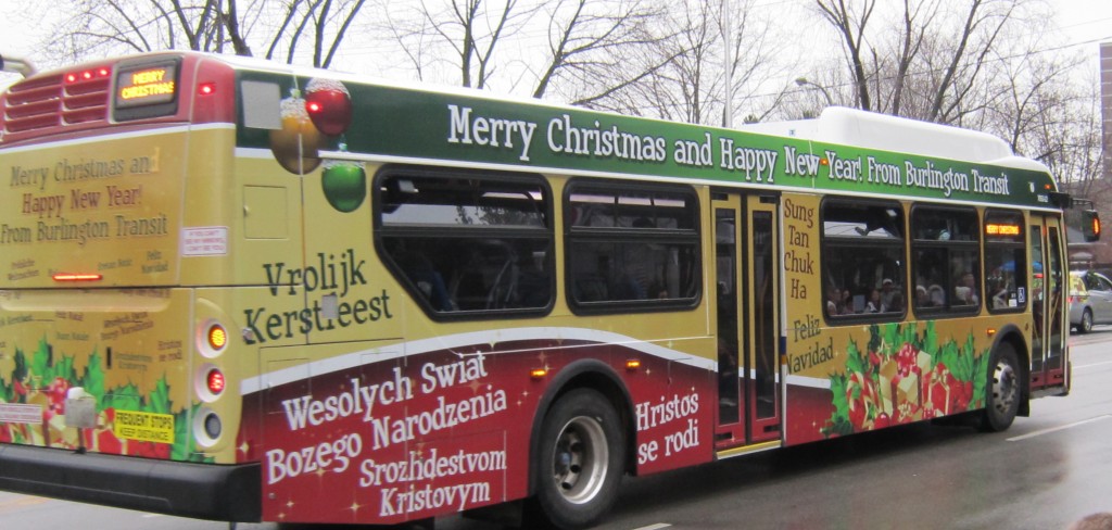 Burlington Transit put their most festive bus into the parade.  The language doesn't matter - the message is still the same.