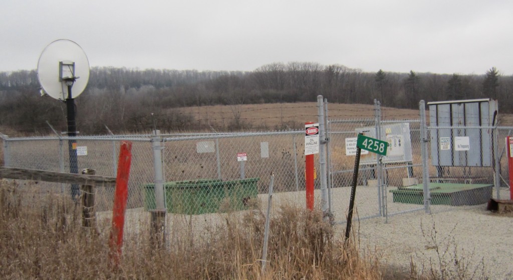 The Enbridge pipeline monitoring site on Walkers Line – looking west. Enbridge can control the flow of oil through this location from their control rooms in Edmonton. Does that make the line safer? The satellite dish in the upper left handles the signals