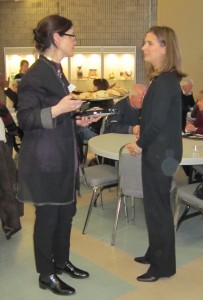 Anne McIlroy on the left, who served cookies to the 25+ people who attended the meeting, talks with with Andrea Smith
