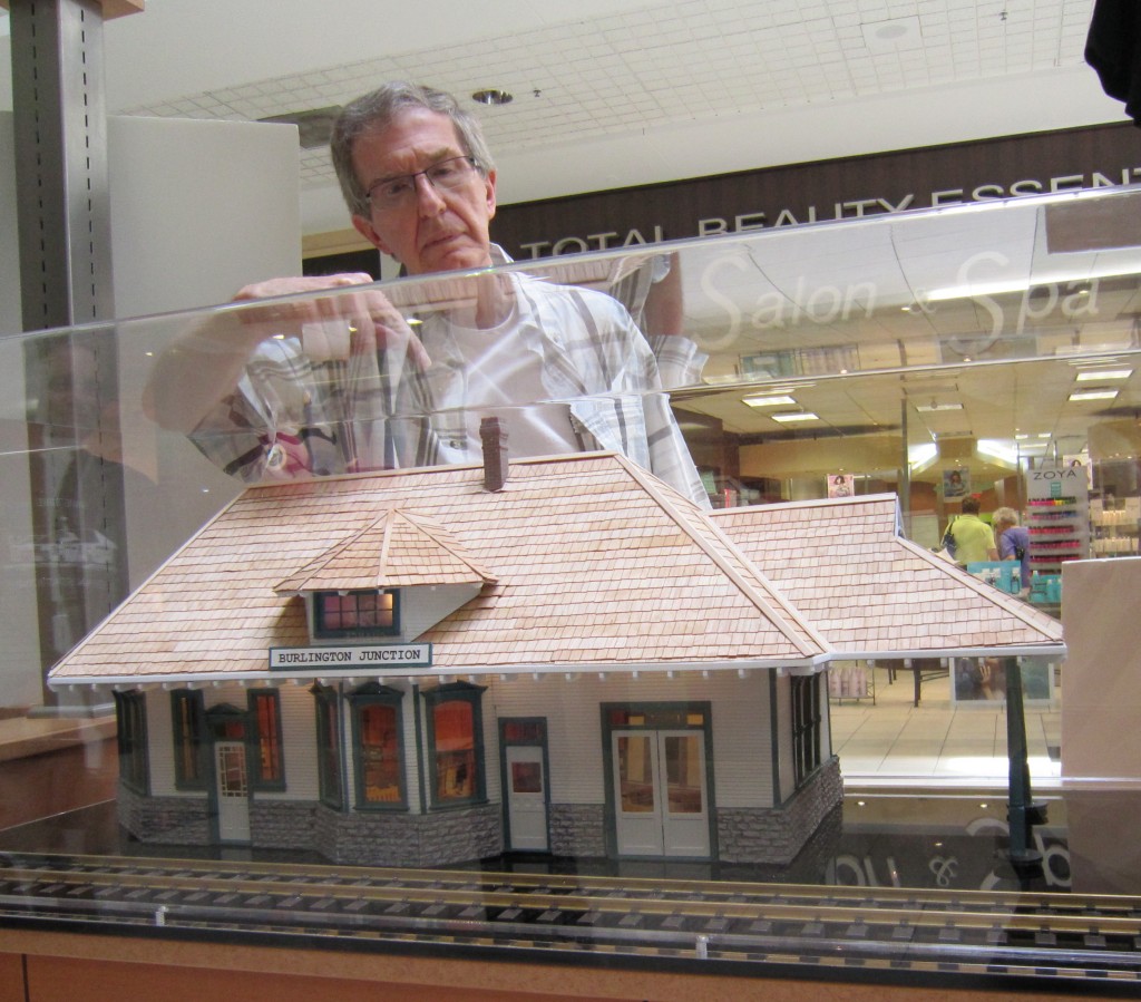 Bob Chambers points to a detail of the Freeman Station model he built in his kitchen in a short 41/2 months. The model got its first public viewing at the Burlington Mall on Sunday.