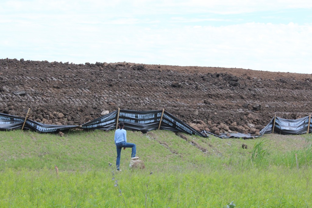 Barbar Sheldon stares up at the small hill or landfill that has been dumped on the property next to hers. The Air PArk next door claims they did not need a permit to dump thelandfuil because they are federally regulated. Sheldon is speechless and cannot beleive this can happen. City council doesn't beleive it can happen either - but it is happening - as we speak. 