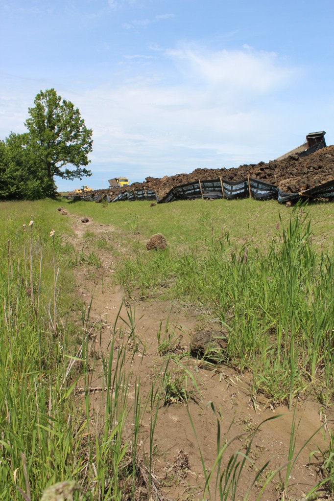 Sheldon Property from ground looking up at angle - trucks