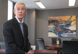 Dan Lawrie, an artist in his own right and also collector sits with a piece of art that is part of his collection.  It was the Lawrie donation that got the city to 