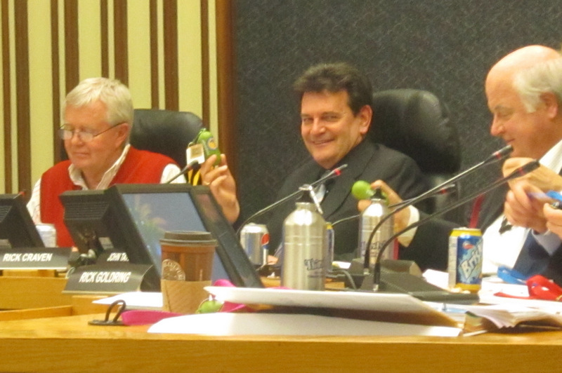 Councillor Rick Craven, centre, with a copy of the 2013 budget on a memory stick. Craven did a superb job of chairing the budget committee last year. He will have no argument with candidate Henshell over the need for additional shopping facilities in Aldershot - getting themt there has been the challenge.