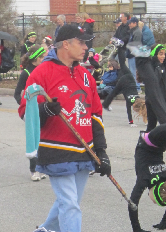 Mayor Goldring picking up donation in the Santa Claus parade - met with other GTA Mayors to pick up provincial finds to help with the ice storm damage.  Maybe he should have taken the hockey stick and the sock with him?