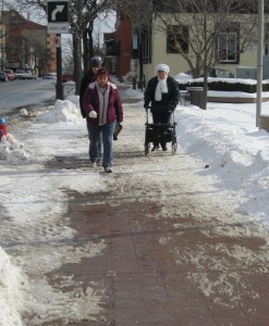 Snow on street - lady - walker
