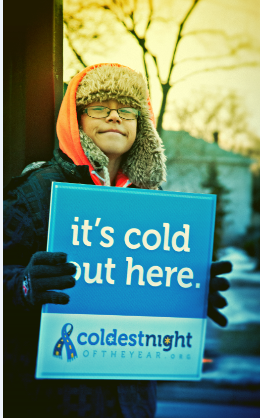 Coldest night - boy with sign