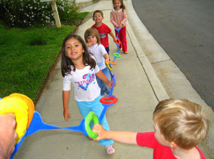 Day care - kids out walking with rope