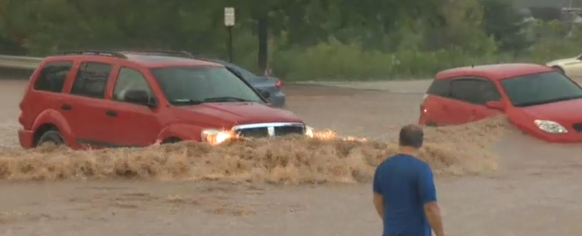 FLOOD red SUV rushing
