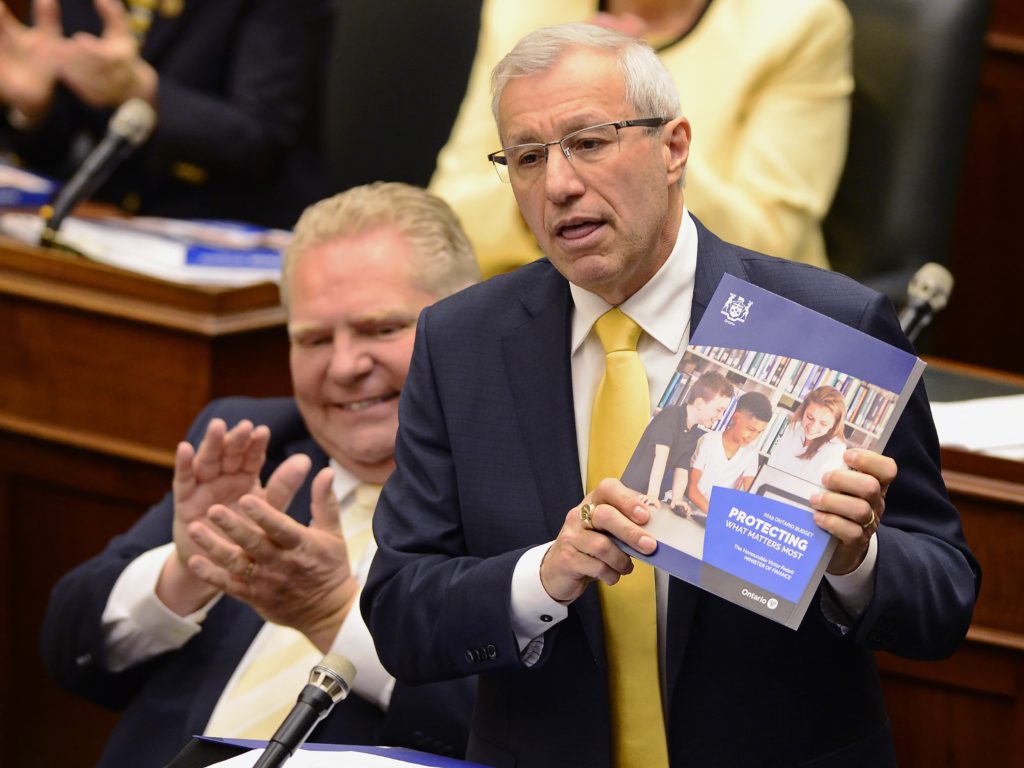 Ontario Finance Minister Vic Fedeli presents the 2019 budget as Premier Doug Ford looks on at the legislature in Toronto on Thursday, April 11, 2019. THE CANADIAN PRESS/Frank Gunn