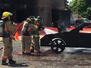 Fire fighters with hoses