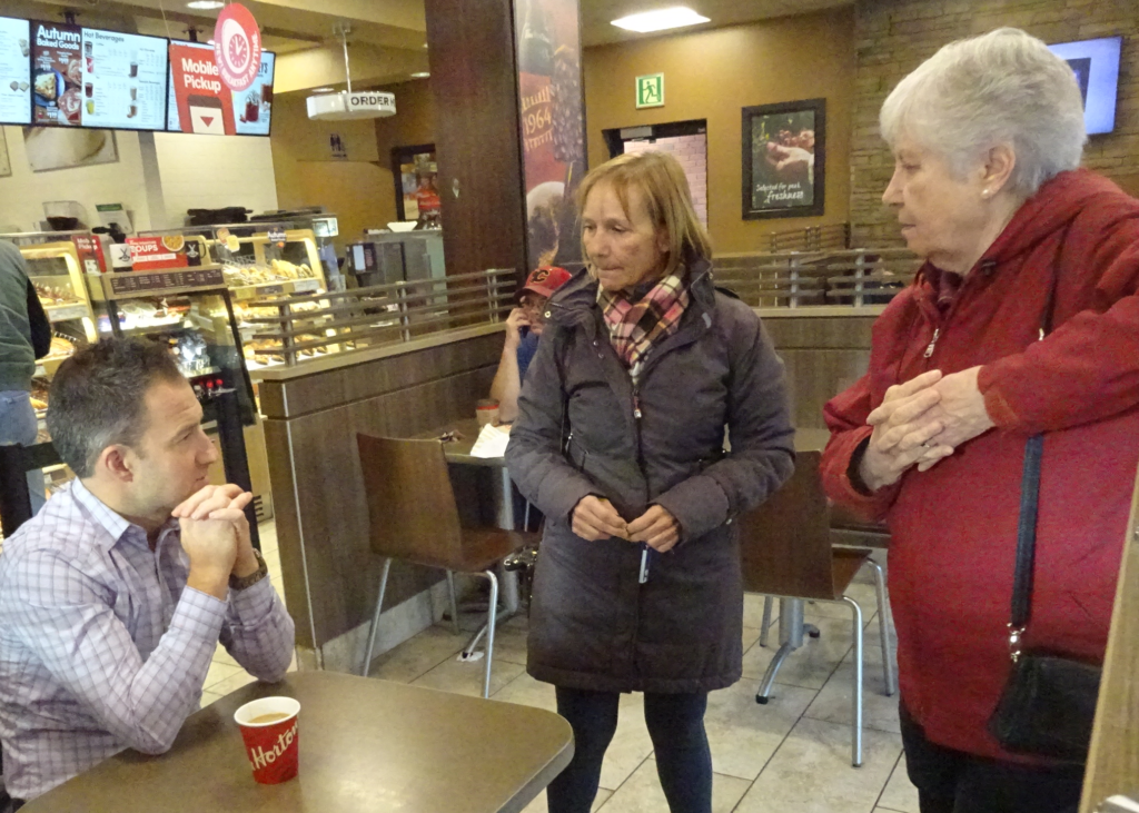 Galbraith with two women in Tim