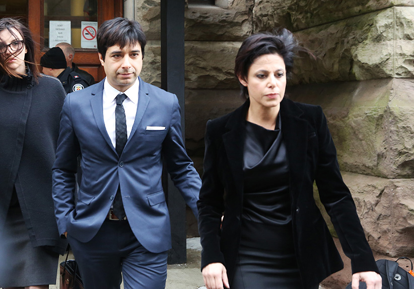 Former Canadian radio host Jian Ghomeshi leaves court with his attorney Marie Henein (R), after an Ontario judge found him not guilty on four sexual assault charges and one count of choking in Toronto, March 24, 2016. Jenna Marie Wakani/Reuters