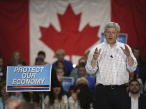 Harper with economy signs