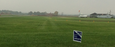 Lancaster sign near runway