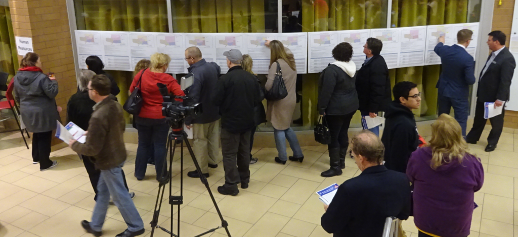 Parents in front of maps