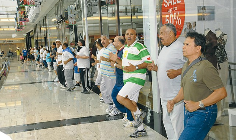 People exercising in a mall
