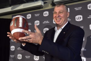 Randy Ambrosie tosses a football as he speaks during a press conference in Toronto, Wednesday July 5, 2017. The CFL says Ambrosie will serve as the 14th commissioner in league history. THE CANADIAN PRESS/Frank Gunn