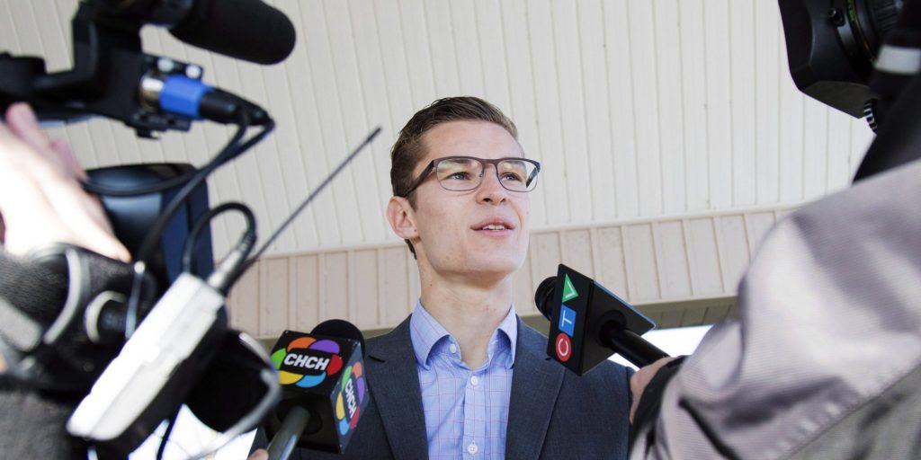 Progressive Conservative candidate Sam Oosterhoff, for Niagara-West Glanbrook, speaks to members of the media after casting his vote in the byelection at Spring Creek Church in Vineland, Ontario, Thursday, November 17, 2016. Oosterhoff, the 19-year-old PC candidate in Niagara who hopes to become the youngest ever member of the Ontario legislature, says people are angry about their hydro bills and industrial wind turbines installed in the riding. THE CANADIAN PRESS/Aaron Lynett