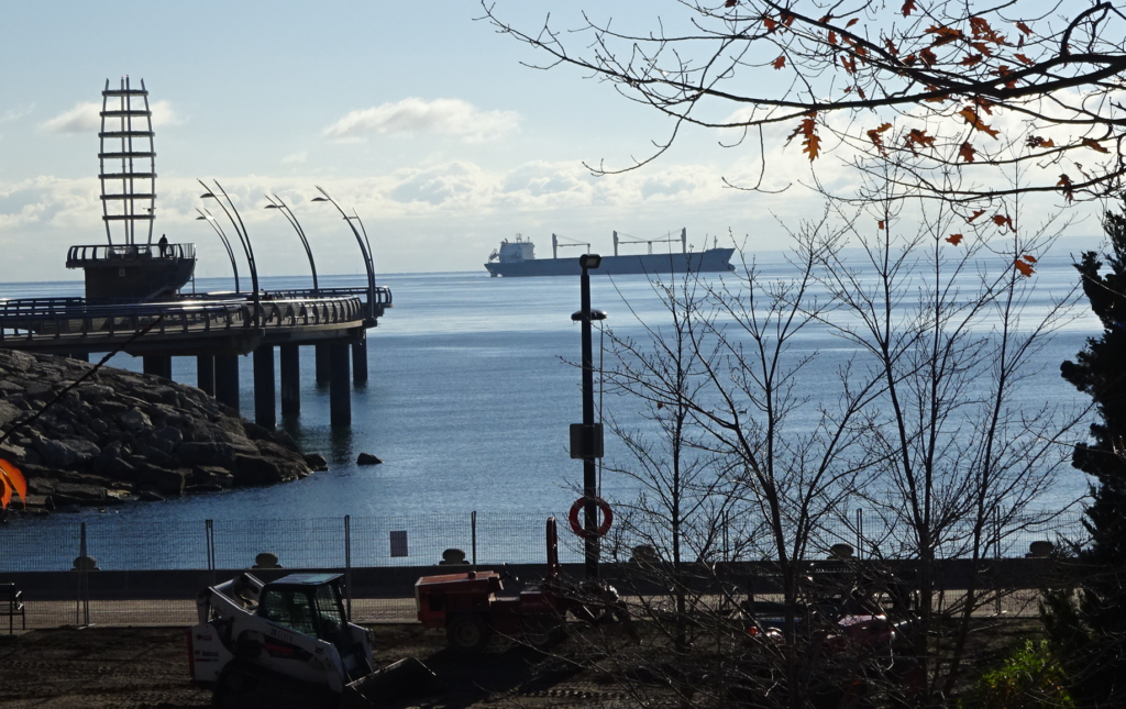 ship-gliding-by-the-pier