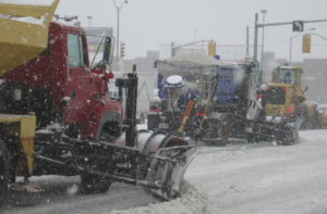 Snow plows in tandem