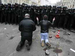 Ukraine - men on knees