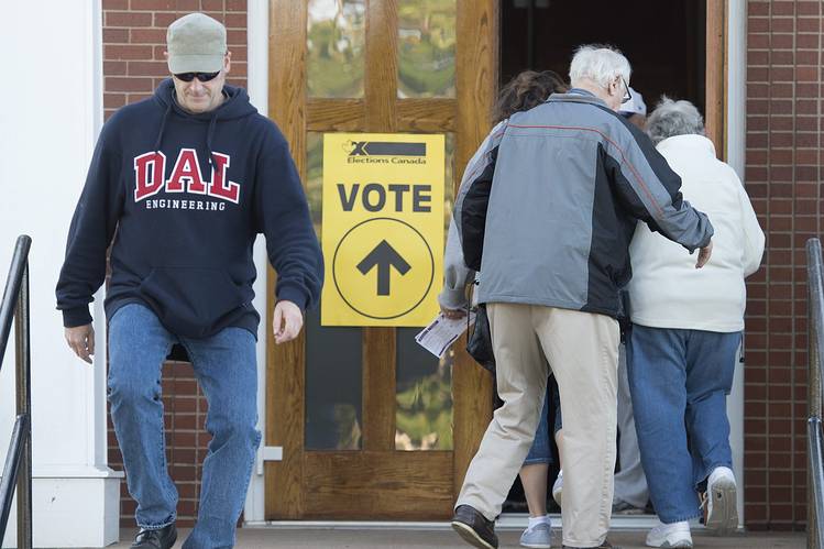 Voters going in door