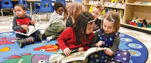 Students at Lincoln Centennial public school. Ontario school boards are struggling to find low-cost options to school additions to accommodate full-day kindergarten. Some options may include bussing kids. Reading are Heyley Ta and Zeynep Coskan-Johnson. Feb 21 2013. Bob TYmczyszyn/St. Catharines Standard/QMI AGENCY