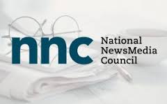nnc logo with glasses